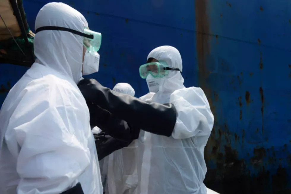 Ebola workers (Photo by ChinaFotoPress/ChinaFotoPress via Getty Images)